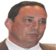 A person in a suit and tie

AI-generated content may be incorrect.