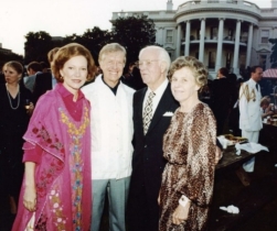 A group of people posing for a photo

Description automatically generated