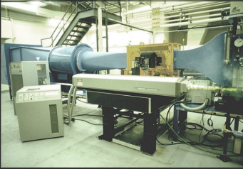 A large blue tube in a factory

Description automatically generated