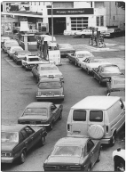 A group of cars in a parking lot

Description automatically generated