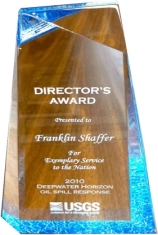 A wooden award with white text

Description automatically generated