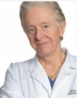 A close-up of a person in a white coat

Description automatically generated