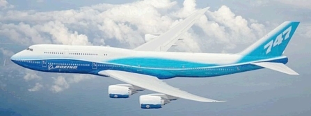 A blue and white airplane in the sky

Description automatically generated