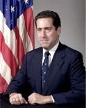 A person in a suit and tie

Description automatically generated