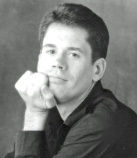 A person with his hand on his chin

Description automatically generated