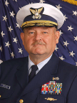 A person in a uniform with a flag behind him

AI-generated content may be incorrect.