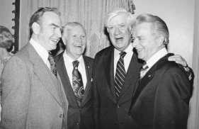 A group of men in suits

Description automatically generated