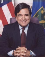 A person in a suit and tie

Description automatically generated
