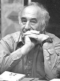 A person with his hands on his chin

Description automatically generated