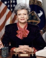 A person in a black suit

Description automatically generated