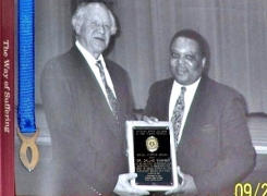 A group of men holding a plaque

AI-generated content may be incorrect.