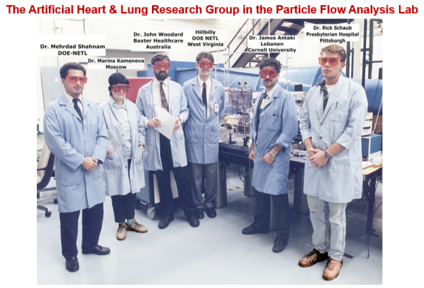 A group of people wearing lab coats

Description automatically generated