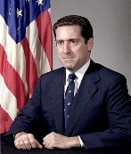 A person in a suit and tie

Description automatically generated