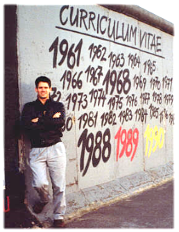 A person standing in front of a wall with numbers

Description automatically generated