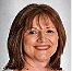 A person smiling with red lipstick

Description automatically generated