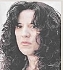 A close-up of a person with long black hair

Description automatically generated