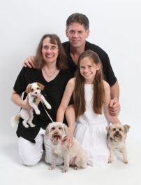 A person and person with dogs

Description automatically generated