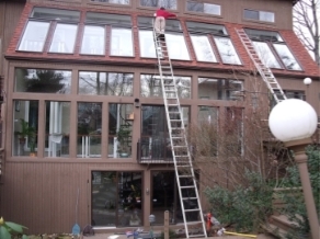 A person on ladders on a roof

AI-generated content may be incorrect.