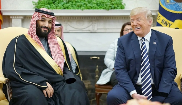 A person in a suit and tie sitting next to a person in a suit

AI-generated content may be incorrect.