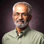 A person with glasses and a beard

Description automatically generated